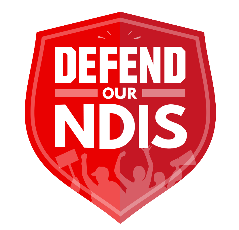 A red shield with the words Defend Our NDIS in capital letters. There are outlines of people on the shield who are at an event with their hands up in solidarity