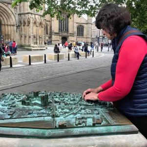 Carleeta touching a tactile map of York.