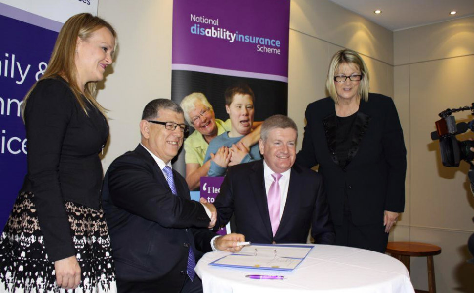 Federal Assistant Social Services Minister Mitch Fifield and NSW Minister for Disability Services John Ajaka sign an agreement