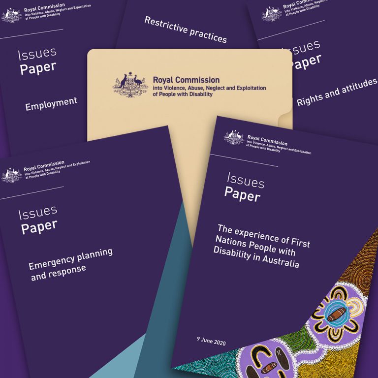 A manilla folder with the Royal Commission into Violence, Abuse, Neglect and Exploitation of People with Disability logo - and issues papers scattered around.