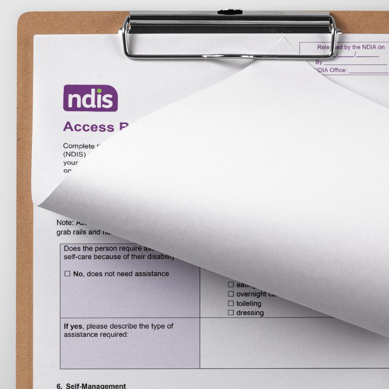 A close up of a clipboard with the NDIS Access Request Form (ARF). The first page is folded up revealing some of page 8 below.