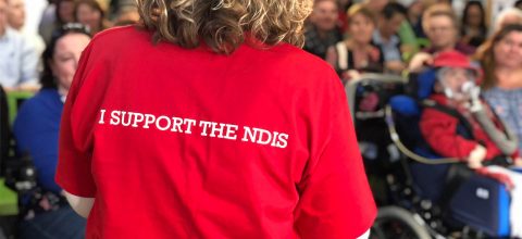 People listening to NDIS information