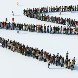 A computer generated illustration showing an enormous line of people queuing in a zigzag as if photographed from a drone or tall building.
